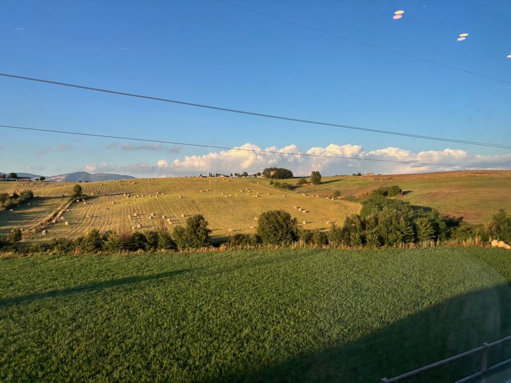 Window view from Frecciarossa to italian landscape
